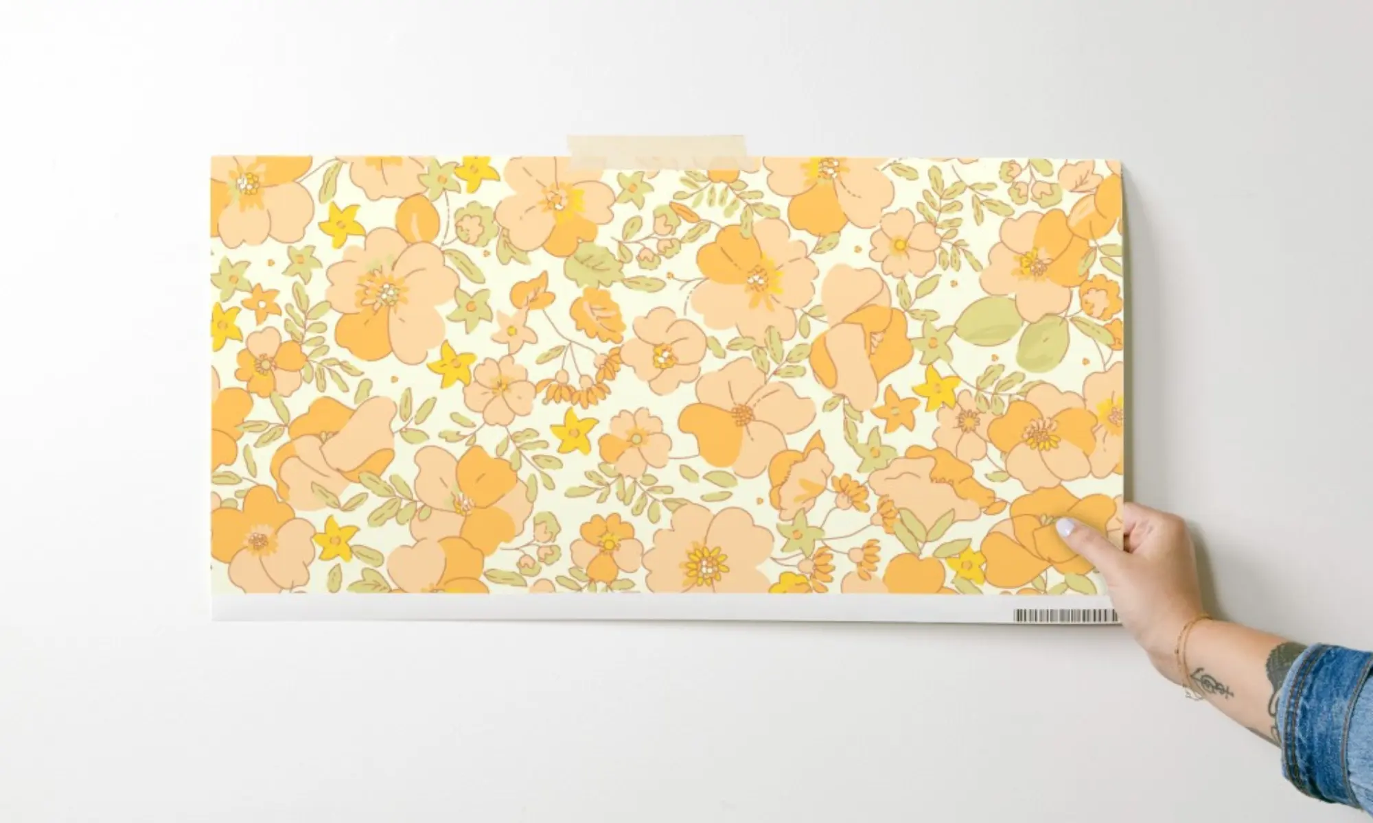 Swatch of wallpaper printed with lemon and bee design.