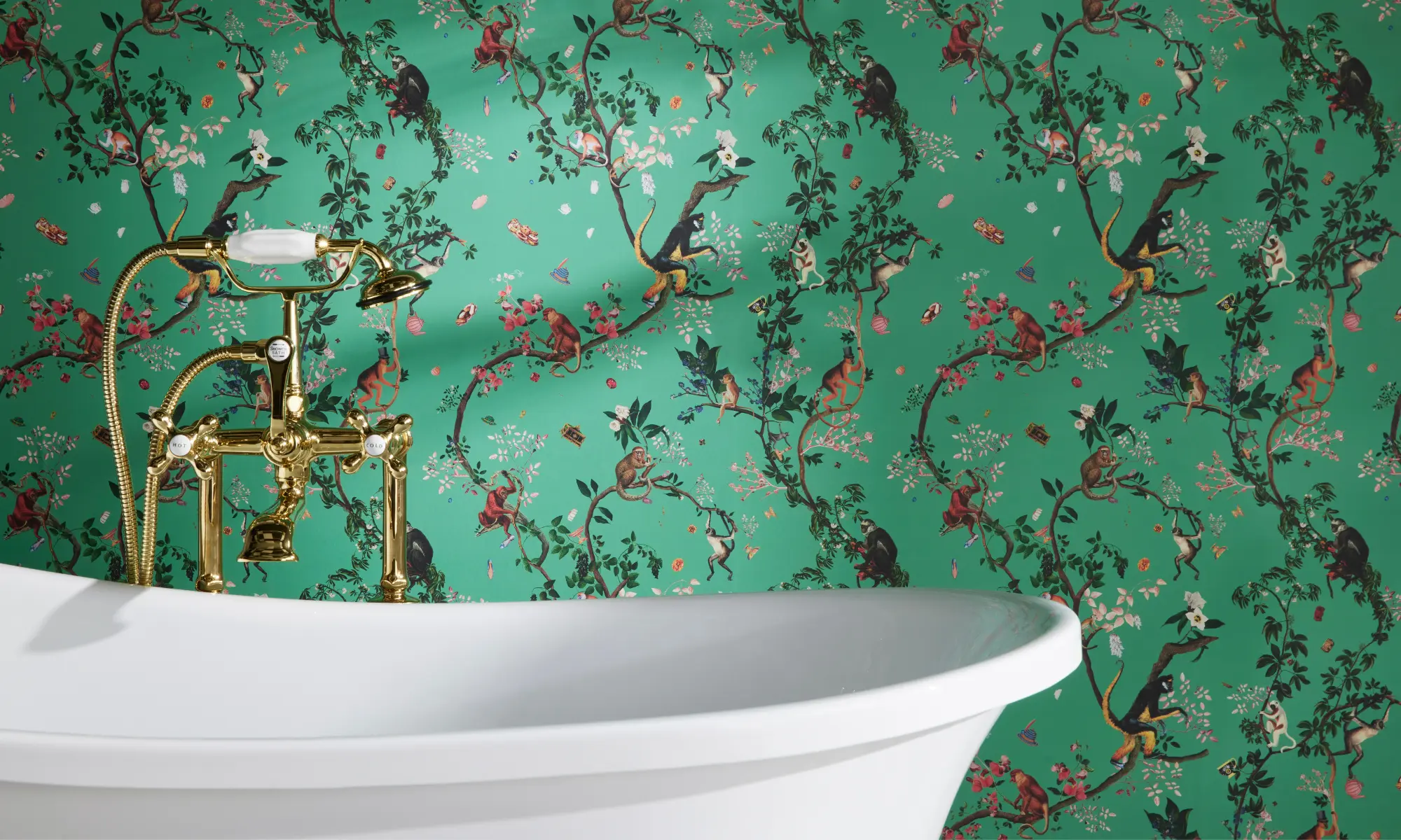 Vintage tub against wall with monkey wallpaper