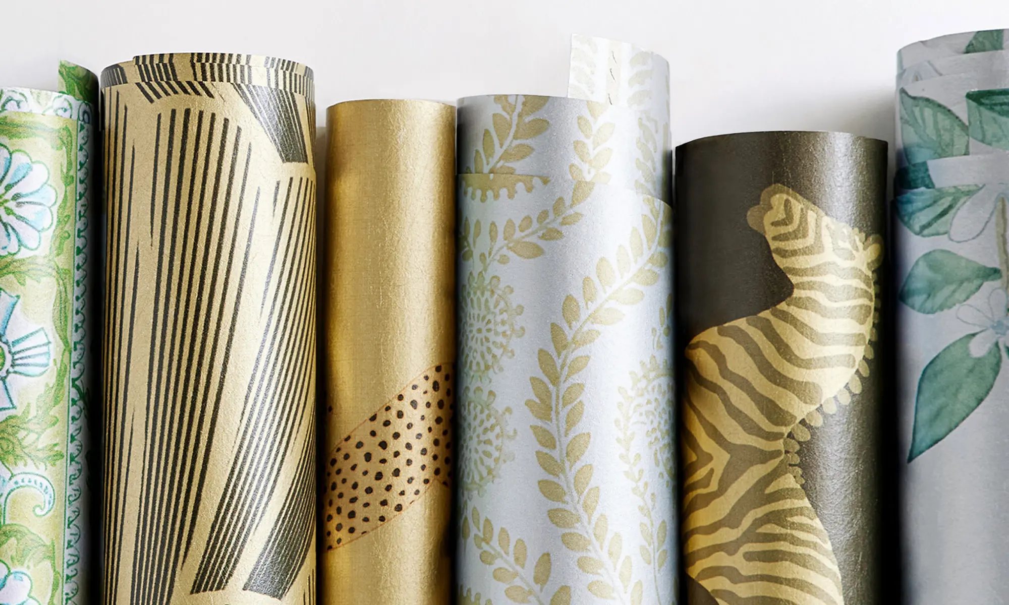 Gold and silver metallic wallpaper rolls