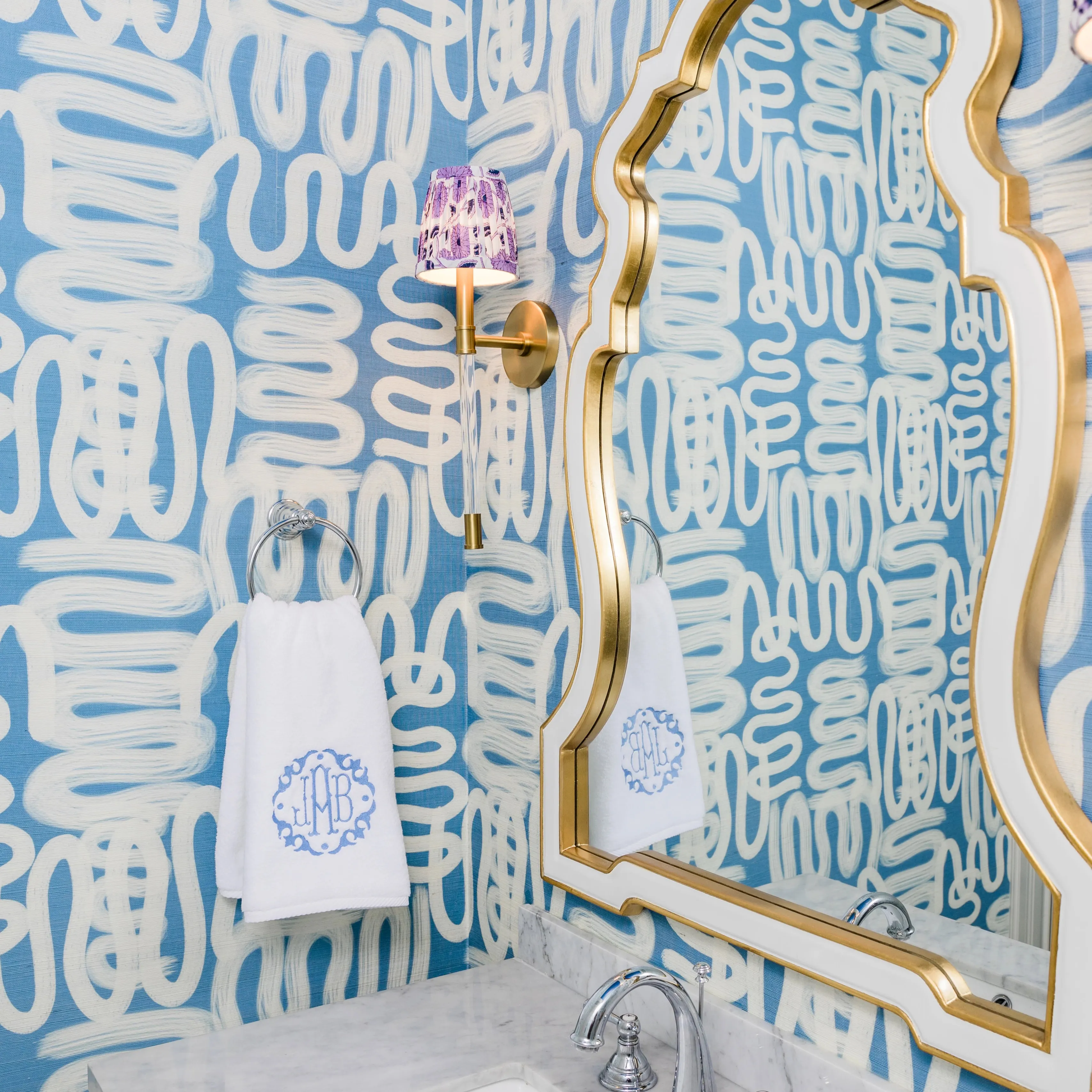 Squiggly blue wallpaper in a bathroom