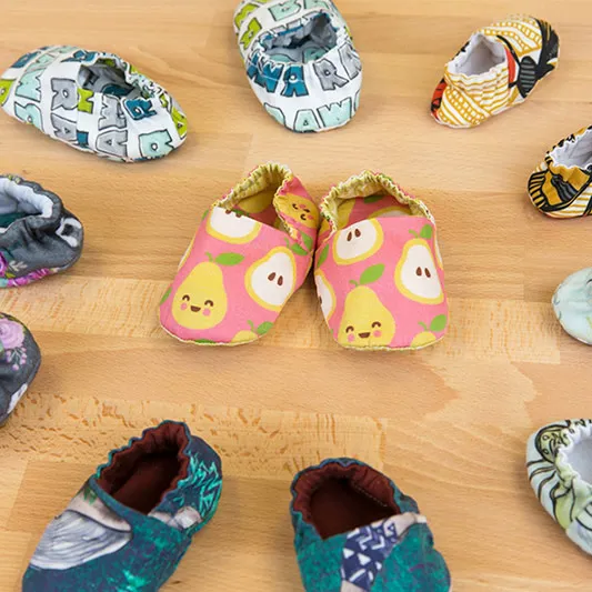 Patterned fabric pairs of baby shoes